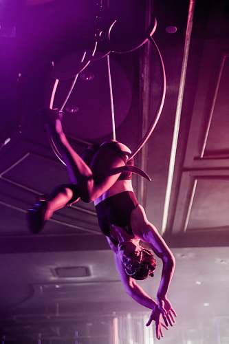 dance pose woman hanging on pole leisure activities